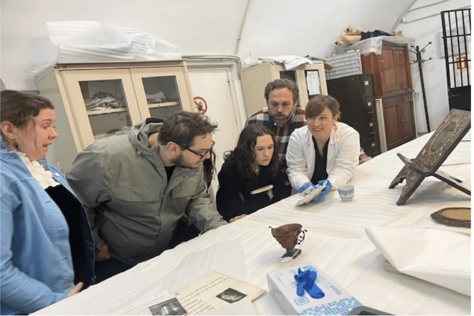 Madrid archive workshop Students study a manuscript in the SLU Madrid library archives.