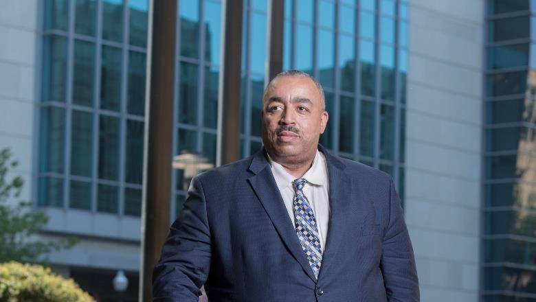 Michael Z. Green poses in front of a building at Texas A & M University School of Law Professor Michael Z Green profile photo