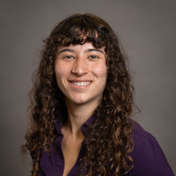 Abby Van Vooren Headshot Abby Van Vooren smiling in a professional headshot.