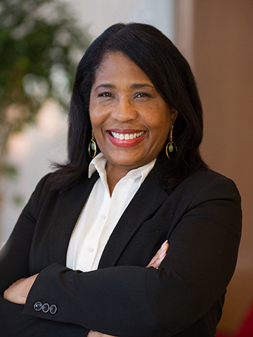 Rochelle D. Smith portrait A posed portrait of Rochelle D. Smith smiling with her arms crossed.