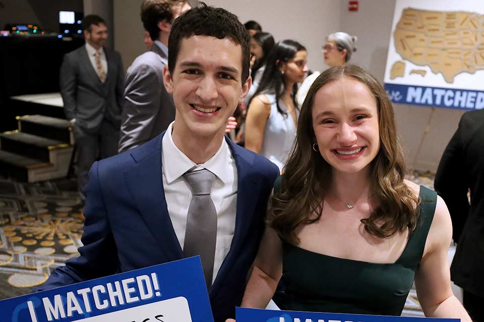 Joey and Erin Talarico Photo of Joey and Erin Talarico holding their Match Day signs