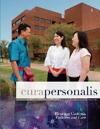 2014 Cura Cover The 2014 cover of cura personlis showing three nursing students in front of the nursing school